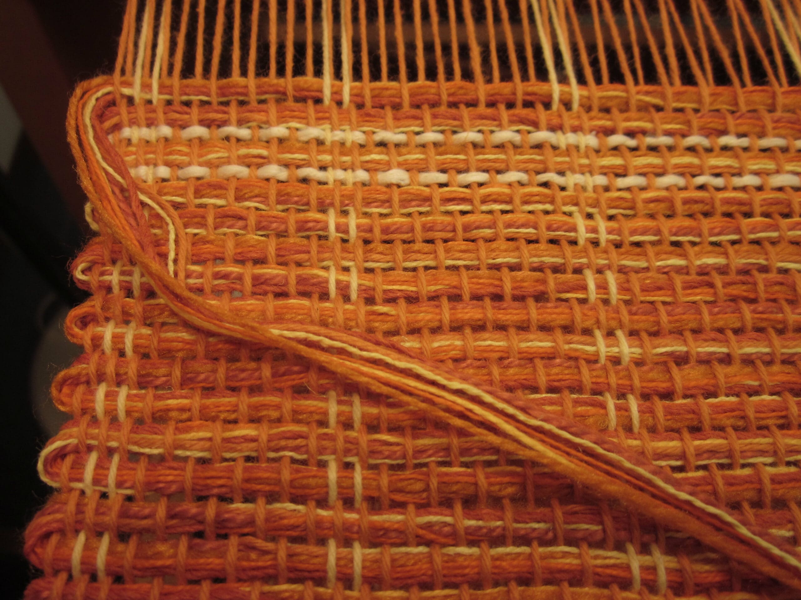 Multiple yarns in the weft