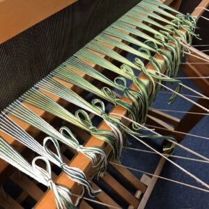 Handwoven Green Fabric - beginning knots